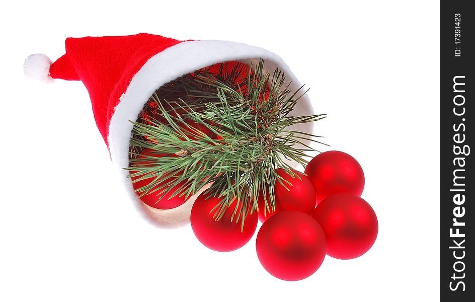 Santa hat and red christmas balls isolated on white background