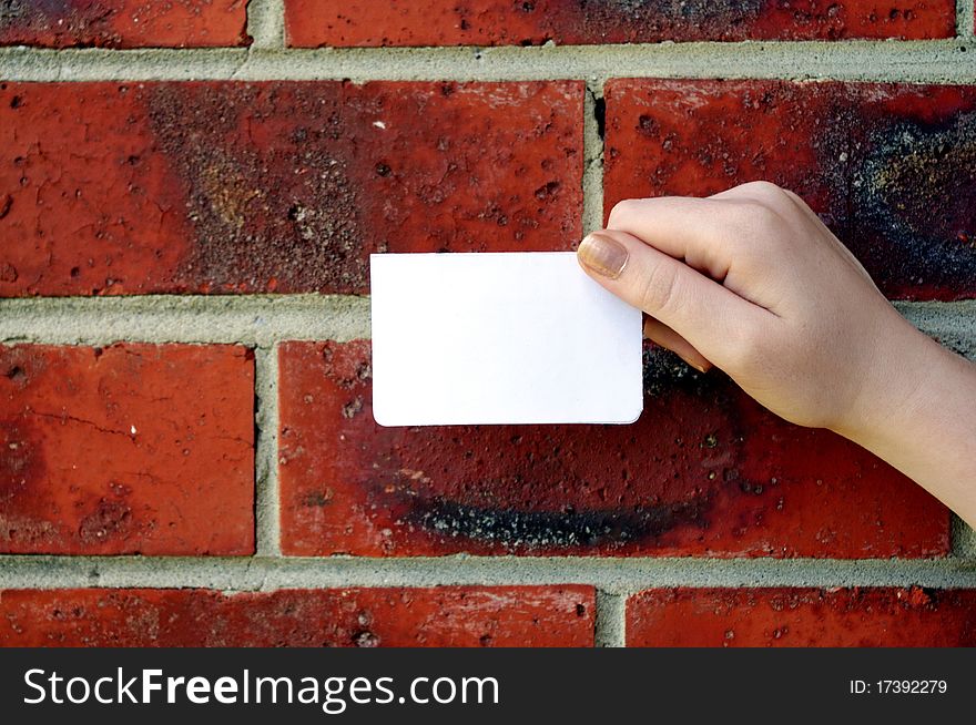 Text your note on brick wall background