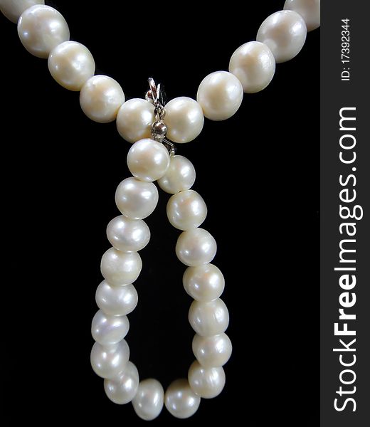 White pearl on isolated black background. White pearl on isolated black background