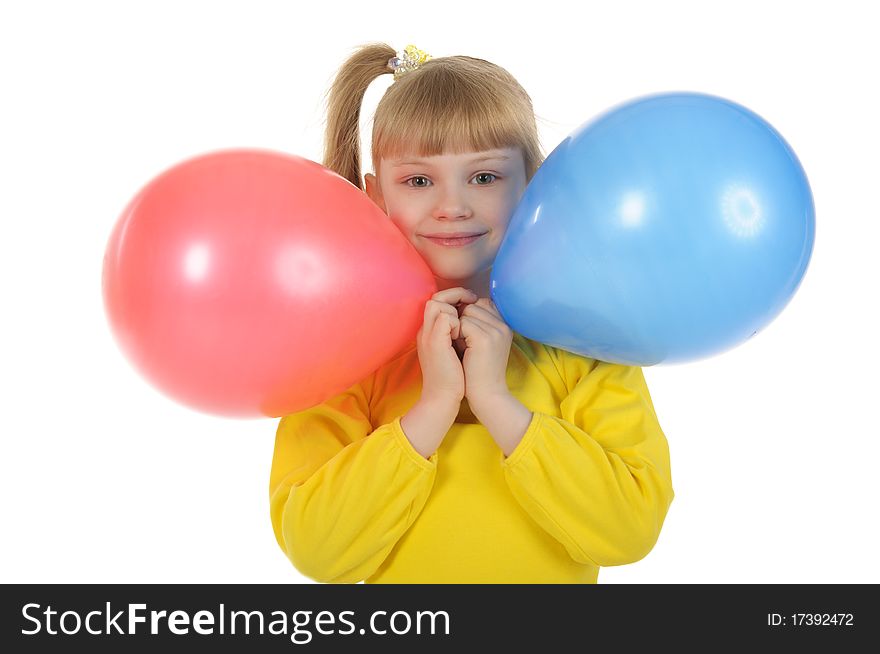 Little girl with colour balls it is isolated on the white