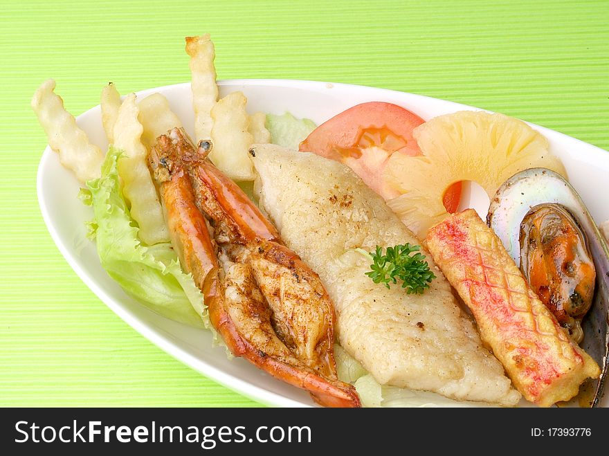 Fresh seafood platter with fried potatoes.