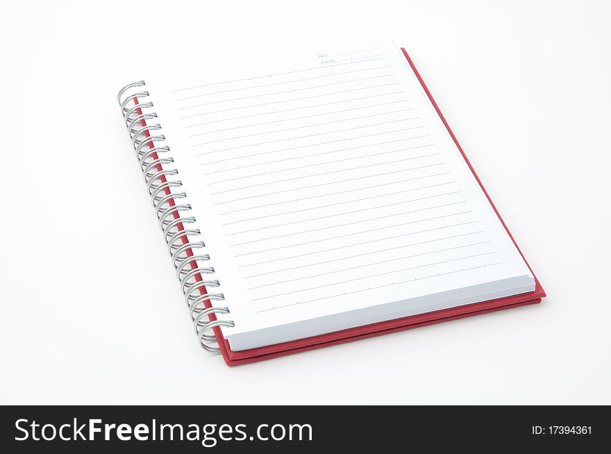 Open red note book on white background