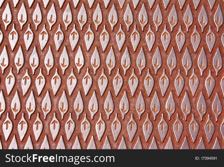 Leaf-like pattern on a steel manhole cover. Leaf-like pattern on a steel manhole cover.