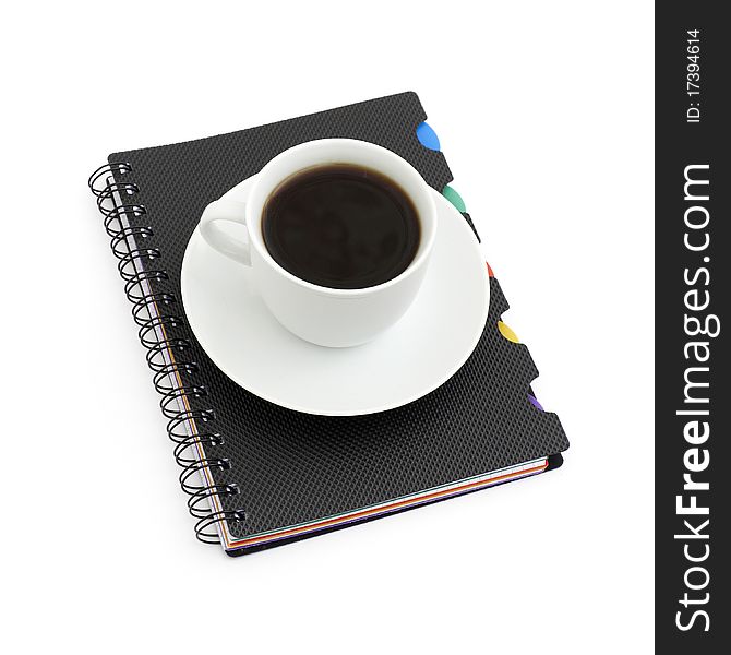 Worktable covered with documents and cup coffee