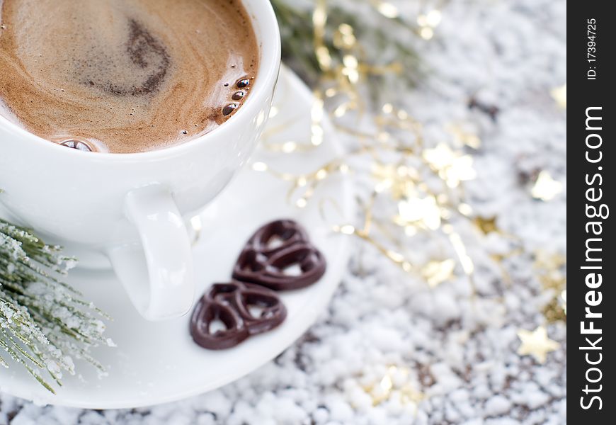 Cup of espresso coffee  with chocolate hearts and Christmas decoration