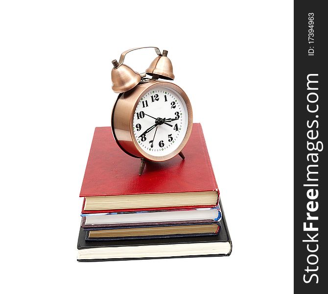 Clock and books on a white background