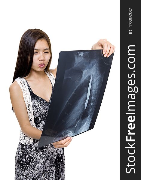 Woman seems to be concernded about an x-ray picture, isolated on white background. Woman seems to be concernded about an x-ray picture, isolated on white background