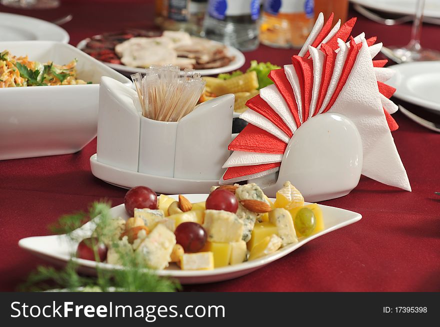 Appetizer, napkins on a celebratory banquet table. Appetizer, napkins on a celebratory banquet table.