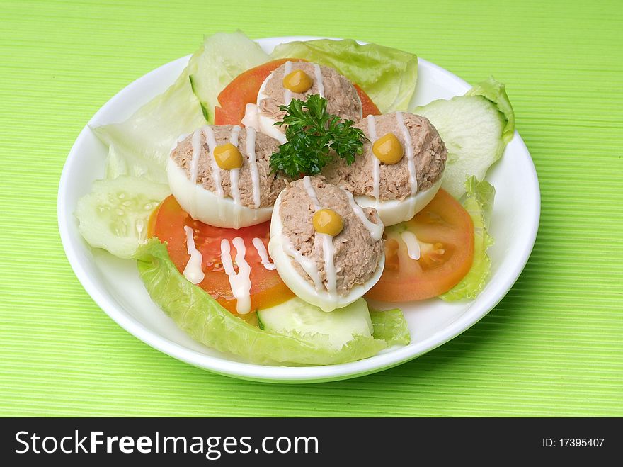 Healthy fresh salad on a plate with eggs, and tuna. Healthy fresh salad on a plate with eggs, and tuna