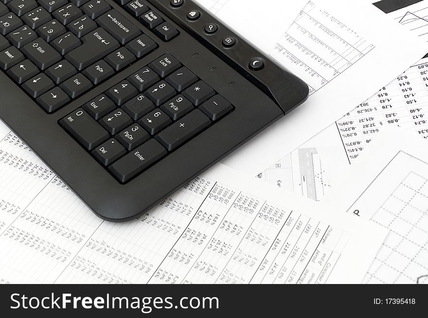 Financial balance. keyboard stands on stack document