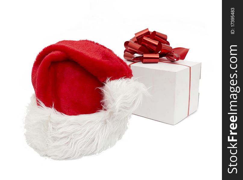 Santa hat and gift isolated on white background