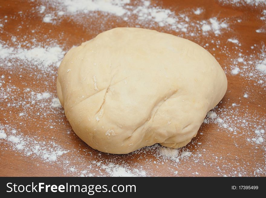 Dough with flour on a table