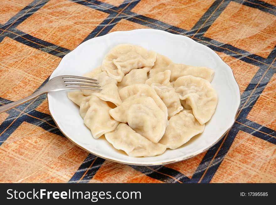 Meat dumplings on a plate with fork