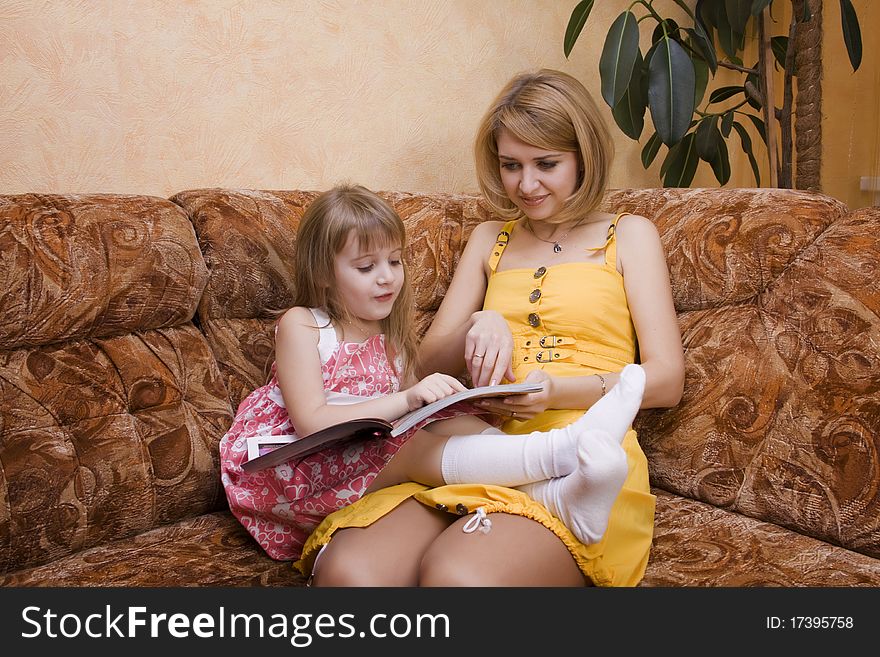 Mum And Daughter Read The Book