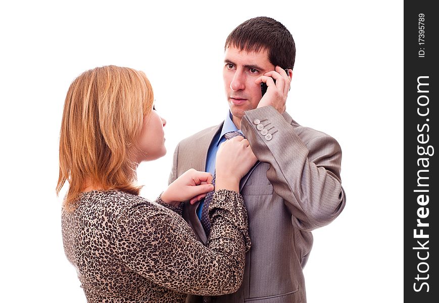 Girl correcting a tie to the man. Girl correcting a tie to the man