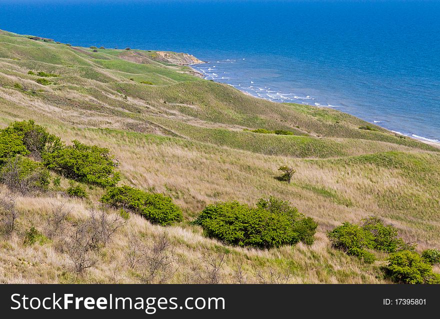 Summer day landscape with the sea and hills. Summer day landscape with the sea and hills