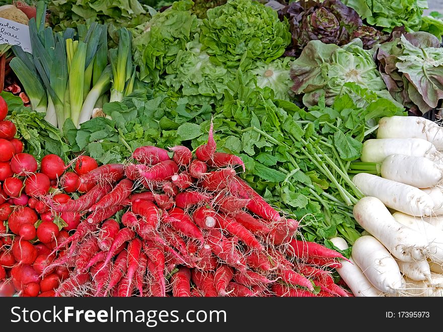 A variety of vegetables on a market stall. A variety of vegetables on a market stall