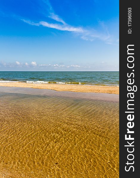 Sand beach, sea and blue sky