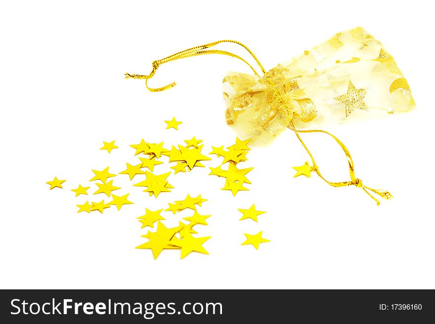 Golden pouch and stars on a white background