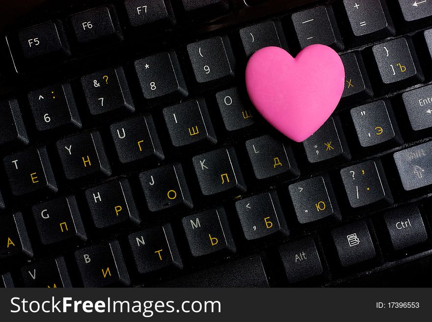 Pink heart on black keyboard. Pink heart on black keyboard