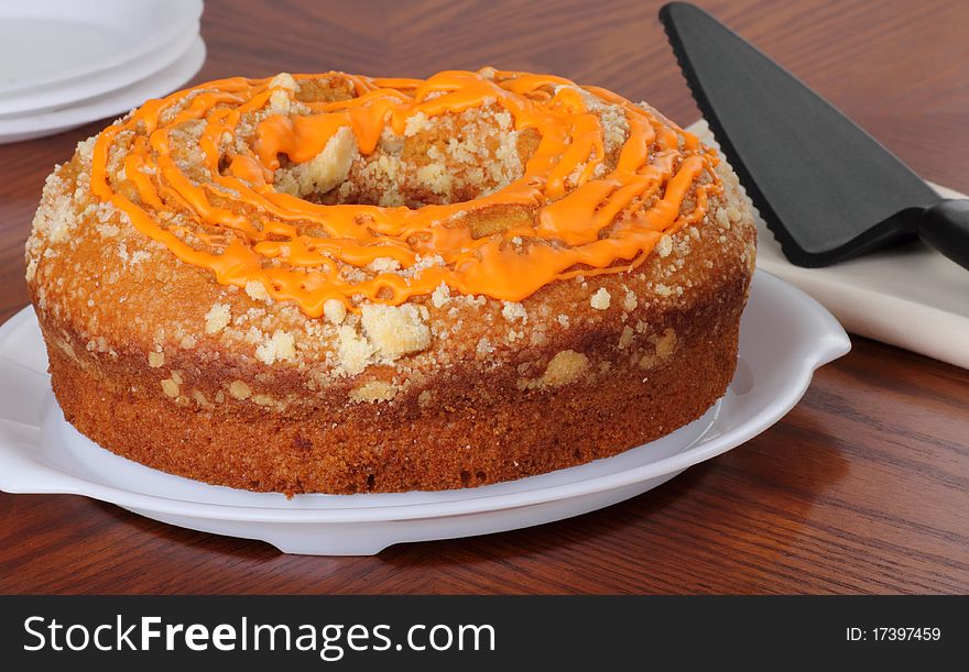 Whole pumpkin cake on a cake platter