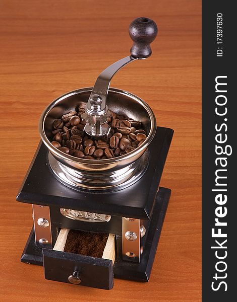 Coffee mill with roasted beans.