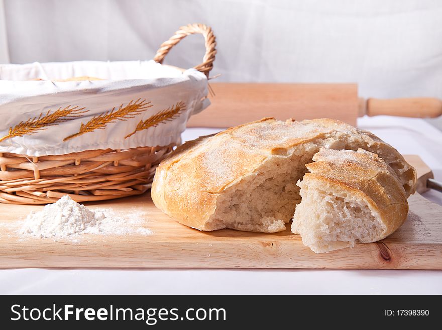 Fresh cooking bread in the basket on the wooden desk. Fresh cooking bread in the basket on the wooden desk