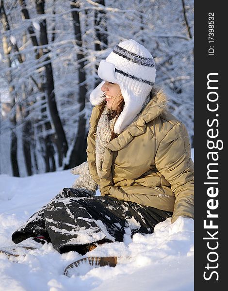 Young woman playing with snow in forest, winter season. Young woman playing with snow in forest, winter season