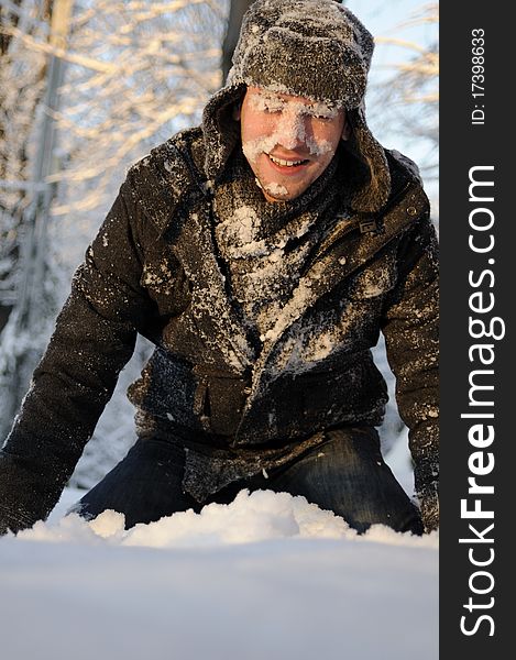 Boy playing with snow in forest, winter season. Boy playing with snow in forest, winter season