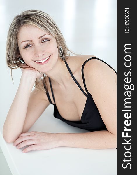 Portrait of a very pretty young woman wearing nice black dress, smiling. Portrait of a very pretty young woman wearing nice black dress, smiling