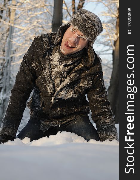 Boy playing with snow in forest, winter season. Boy playing with snow in forest, winter season