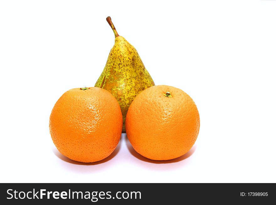 Photo of the pear and oranges on white background