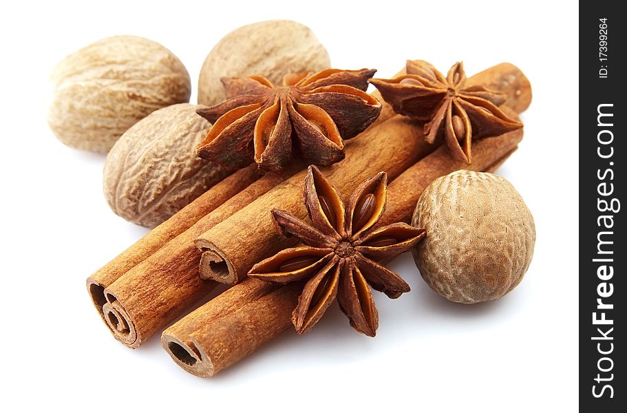 Cinnamon, anise and nutmeg on a white background. Cinnamon, anise and nutmeg on a white background