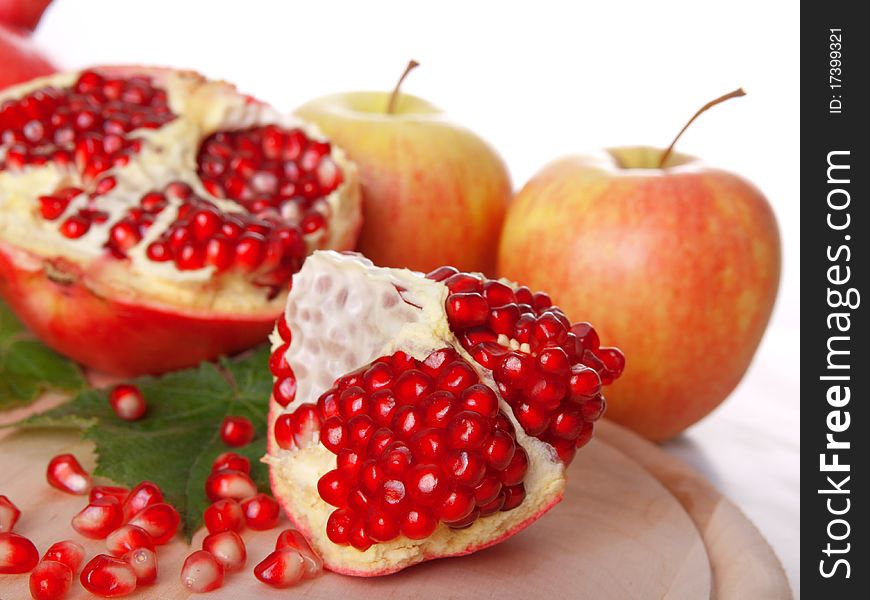 Pomegranate fruit, isolated on white background