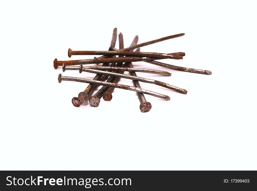 Photo of the rusty nails on white background
