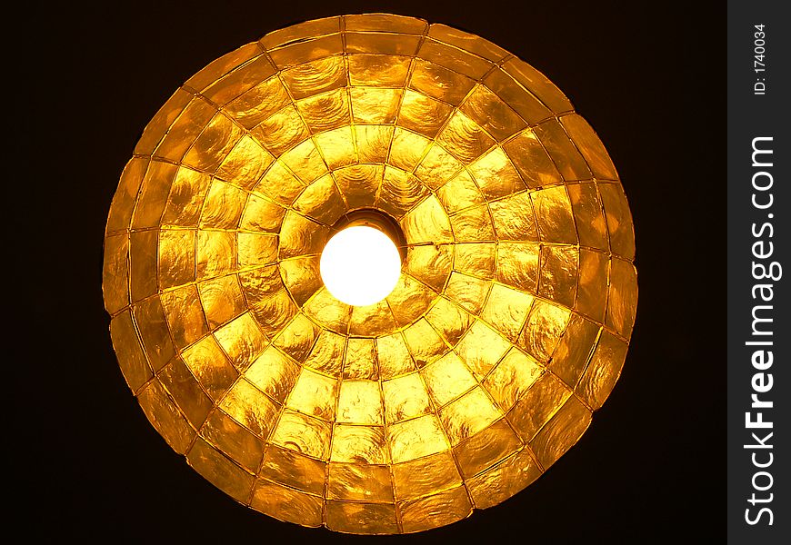 Bottom of the lamp looking like gold ball.