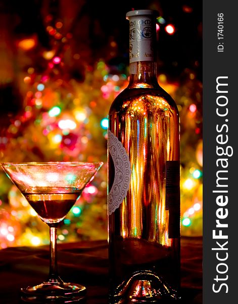 A glass of champagne and abstract lights bokeh background. A glass of champagne and abstract lights bokeh background