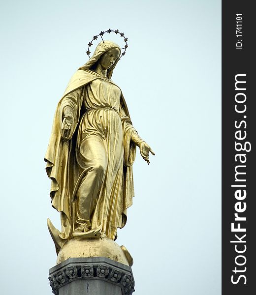 Gold statue of Virgin Marry on the street