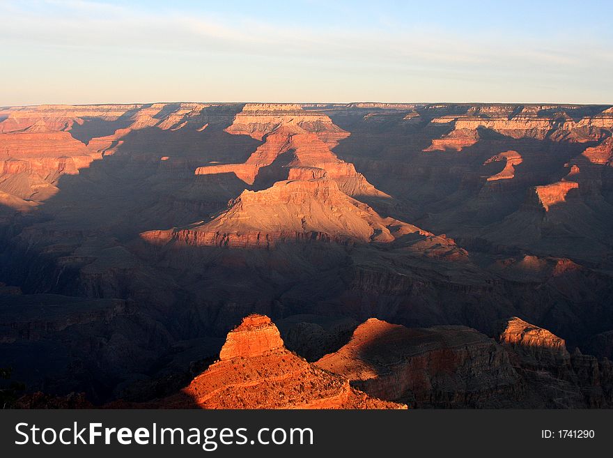 View of the peaks of the Grand Canyon as the sun rises in the morning. View of the peaks of the Grand Canyon as the sun rises in the morning.