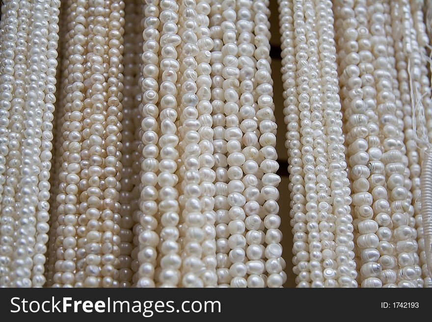 A large number of necklaces from a bead store. A large number of necklaces from a bead store.