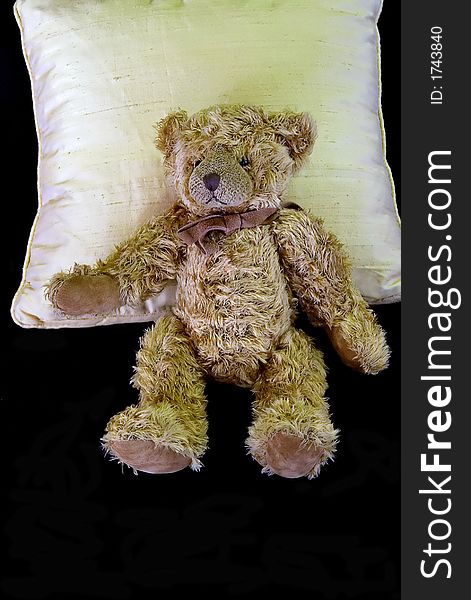 Isolated teddy bear on a pillow