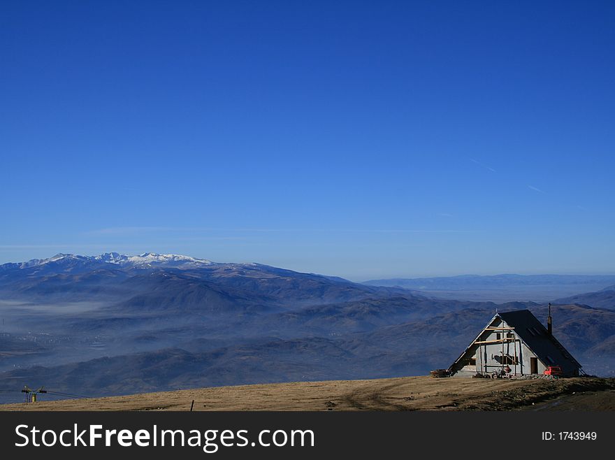 Chalet under the autumn sky. Chalet under the autumn sky