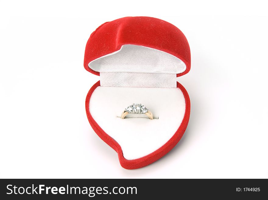 Engagement ring in heart shaped ring box. Engagement ring in heart shaped ring box.