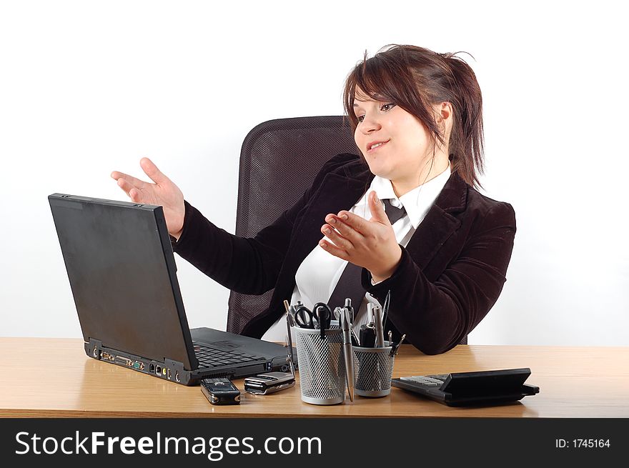 Attractivw woman at desk with laptop on white background. Attractivw woman at desk with laptop on white background