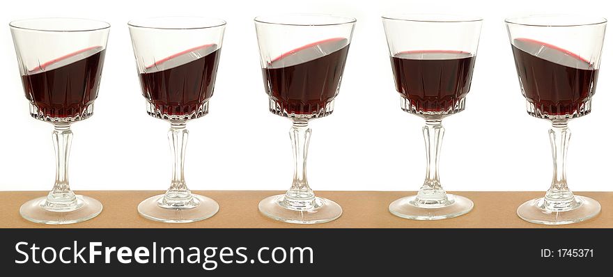 Five wineglasses on a line