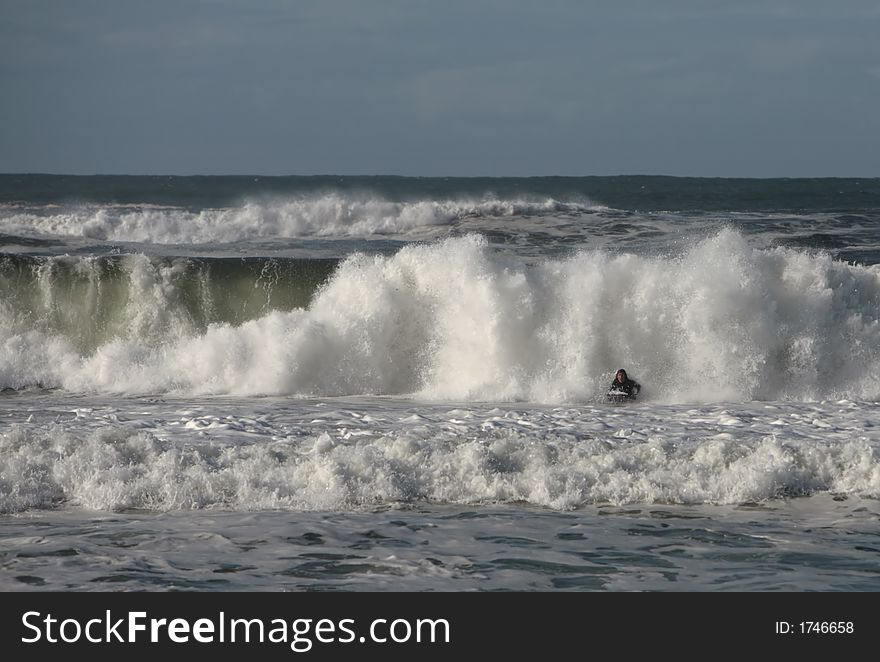 Bodyboarder in front of the wave. Bodyboarder in front of the wave