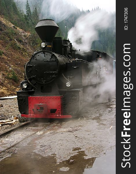 Old steam locomotive driving in speed. Old steam locomotive driving in speed