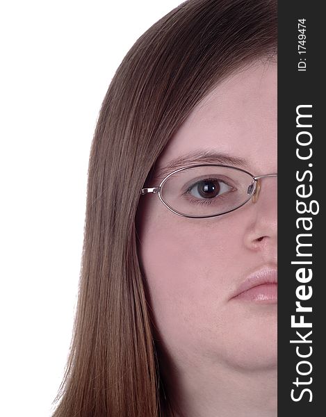One side of a woman's face against a white background. The woman is wearing glasses and has brown eyes.