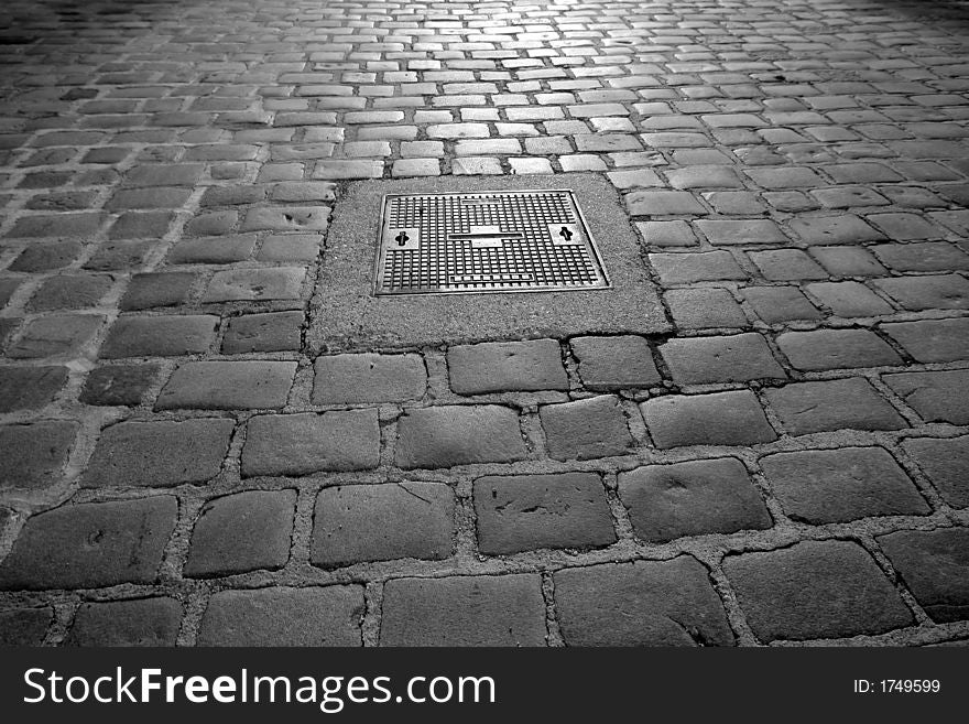 Wet old pathway with light reflection