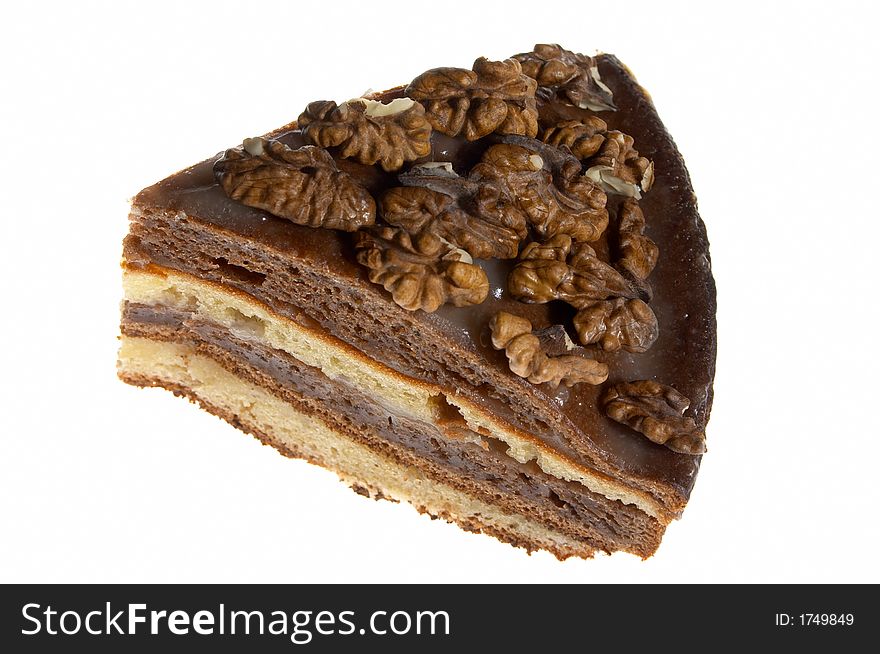 Piece of cake decorated with walnuts. Piece of cake decorated with walnuts